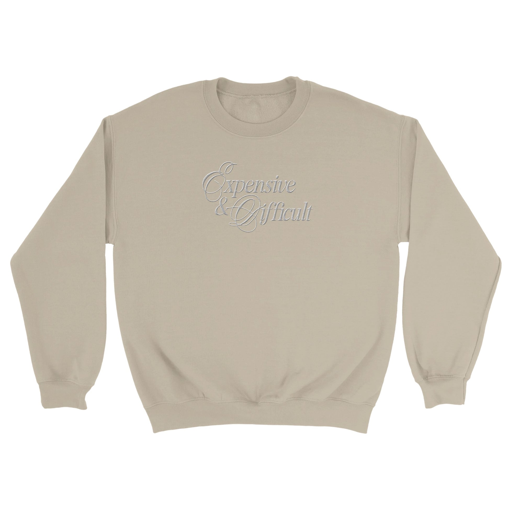 expensive and difficult embroidered on a beige sweatshirt