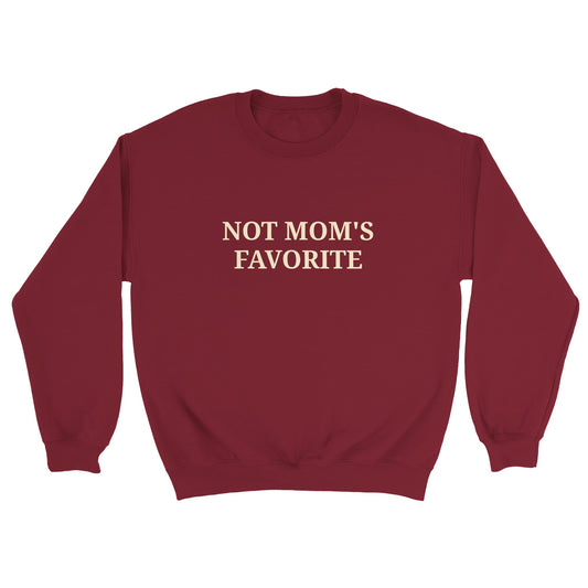 a red sweatshirt with "Not mom's favorite" written across the chest