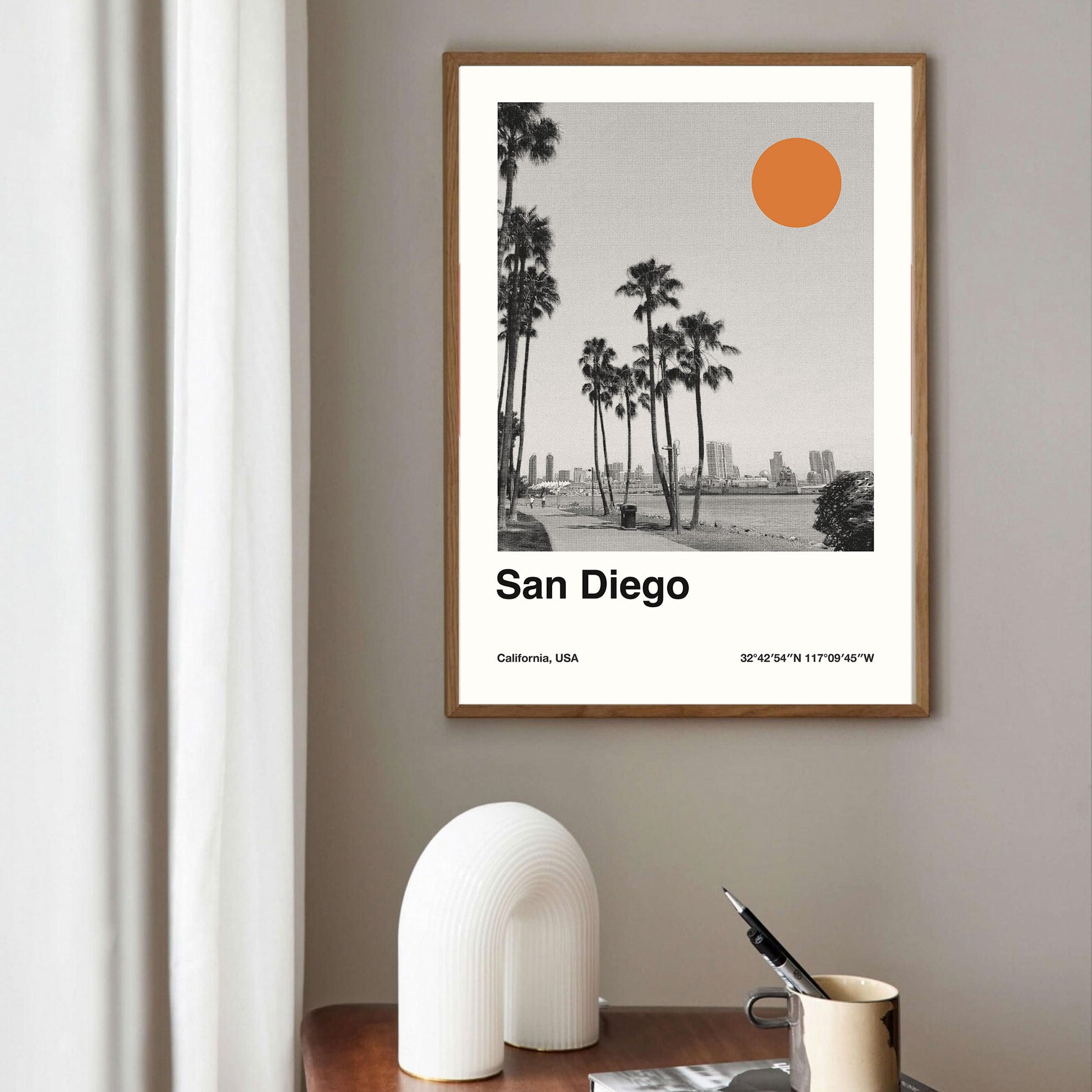 a print art of san diego beach with palm tree and orange sun