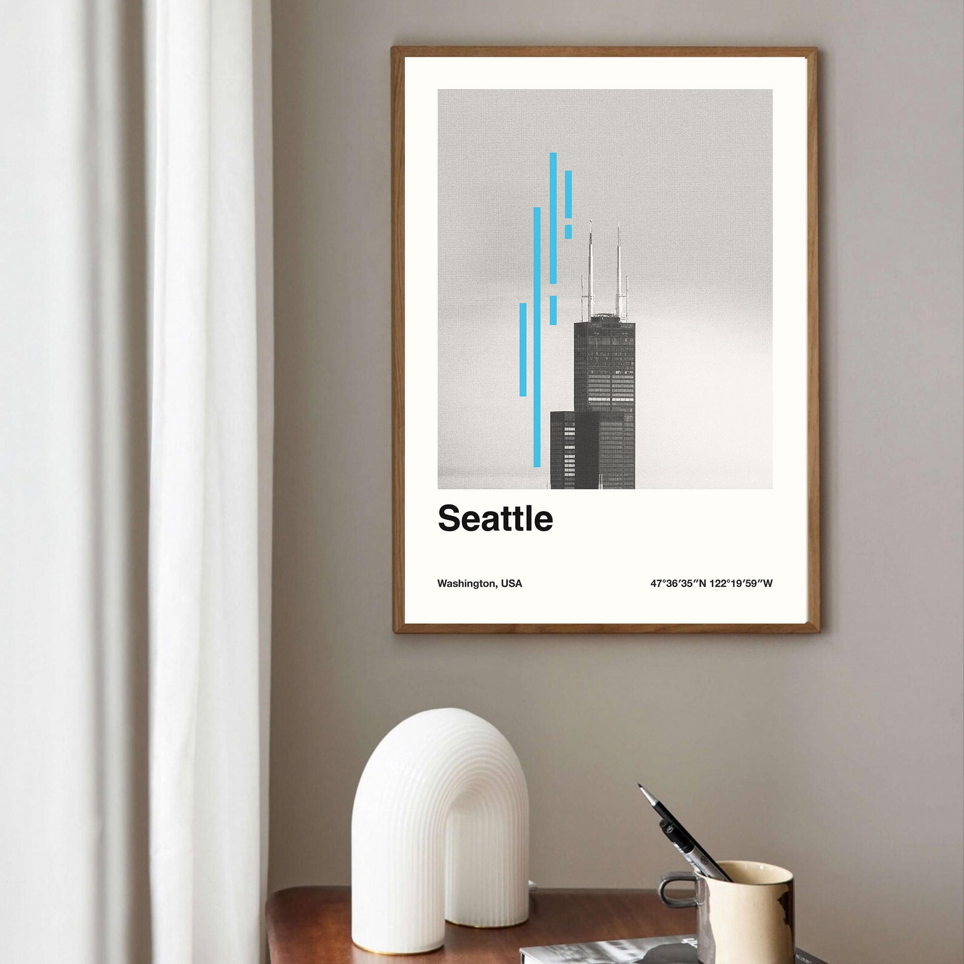 A framed poster of the Seattle skyline by thewallflowerclub.