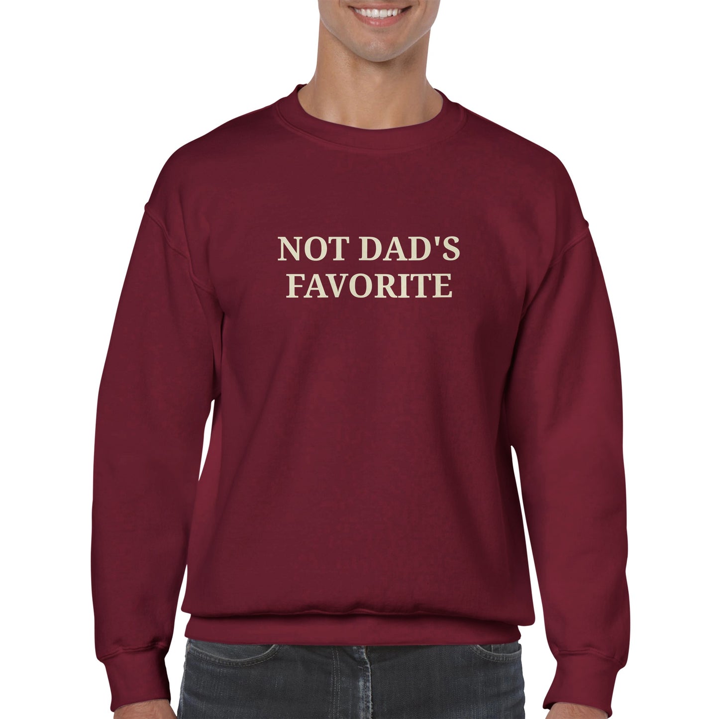 a man wearing a red sweatshirt with "Not dad's favorite" written across the chest